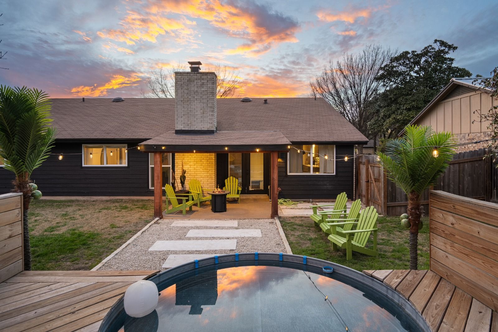 Austin home with a backyard plunge pool at sunset